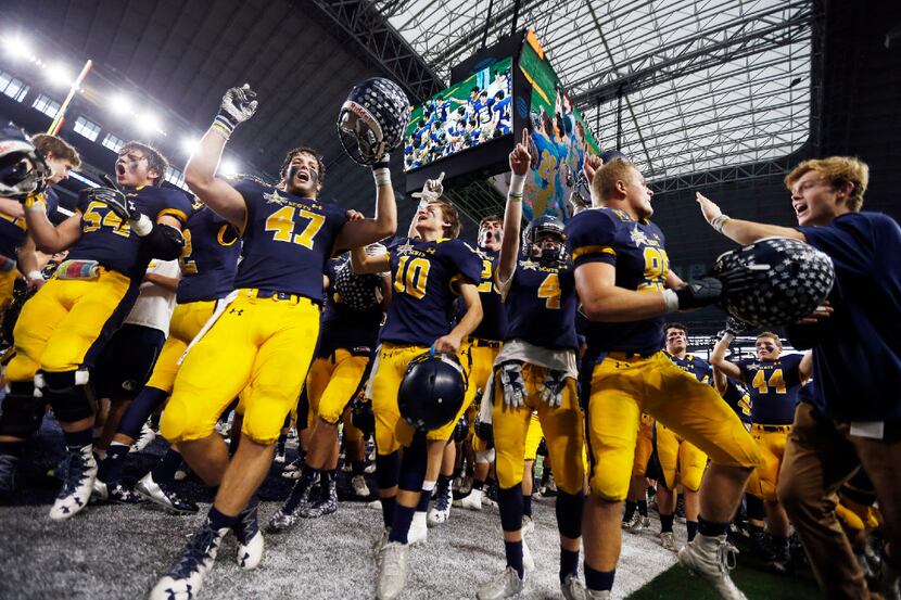 Highland Park players celebrate a 31-24 win over Denton Ryan in a Class 5A Division I state...