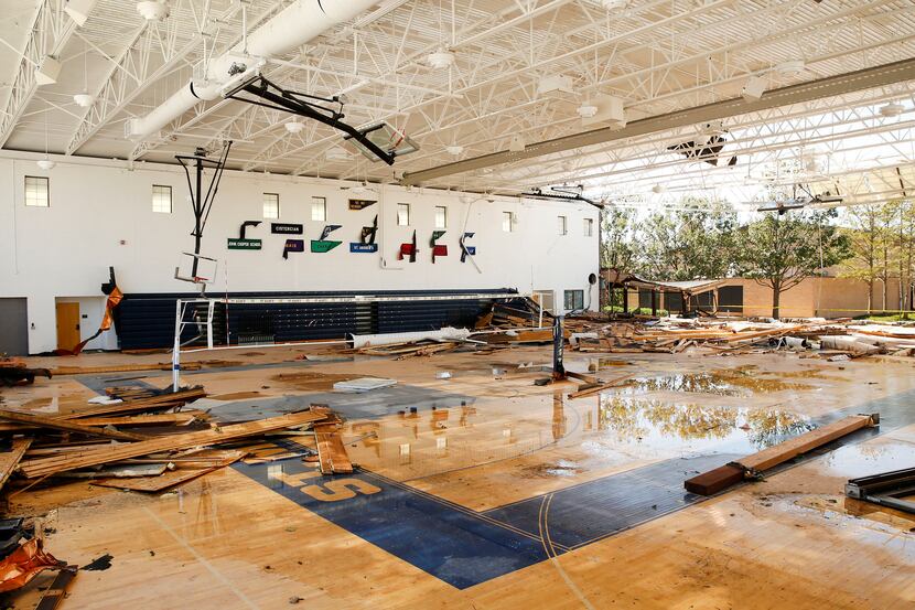 The gymnasium walls at St. Mark's School of Texas were blown over during the tornado in...