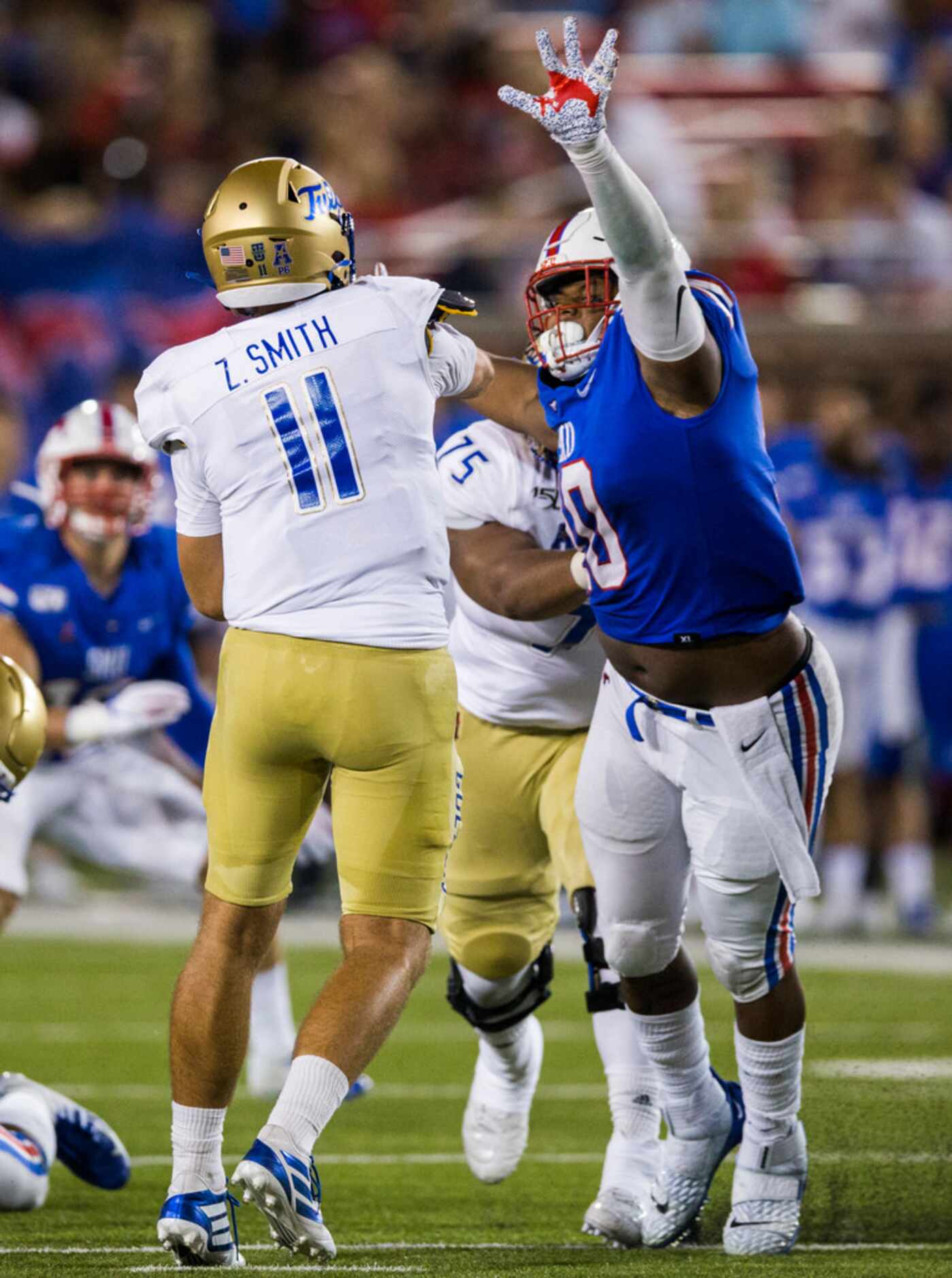 SMU Mustangs defensive tackle Demerick Gary (10) gets a penalty for roughing the passer as...