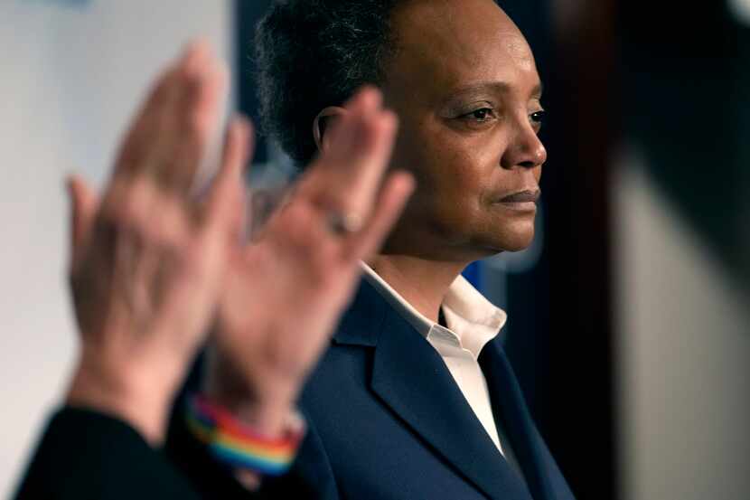 Chicago Mayor Lori Lightfoot pauses during her concession speech as her spouse Amy Eshleman...