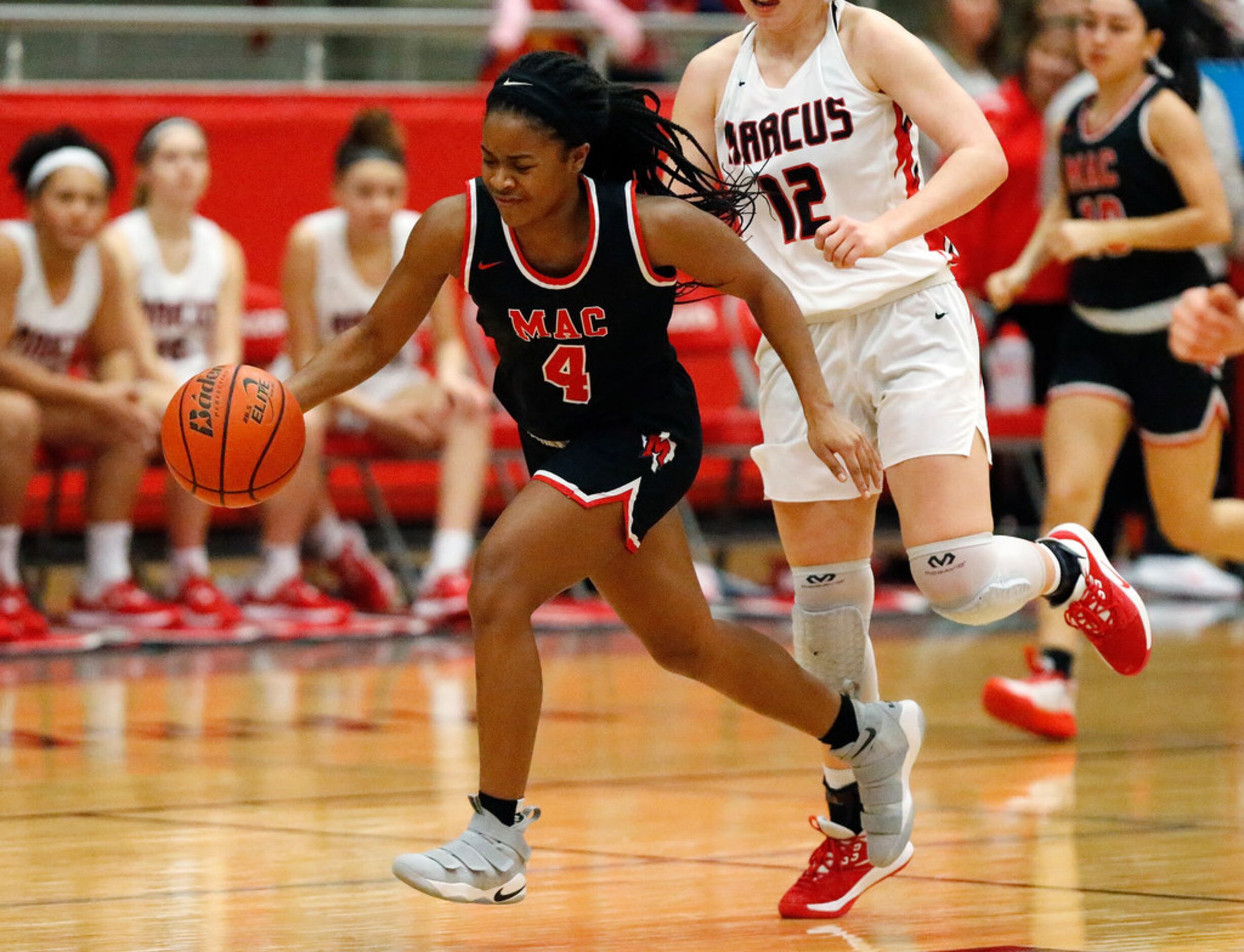 Irving MacArthur High School guard Morgan Browning (4) leads a fast break attempt during the...