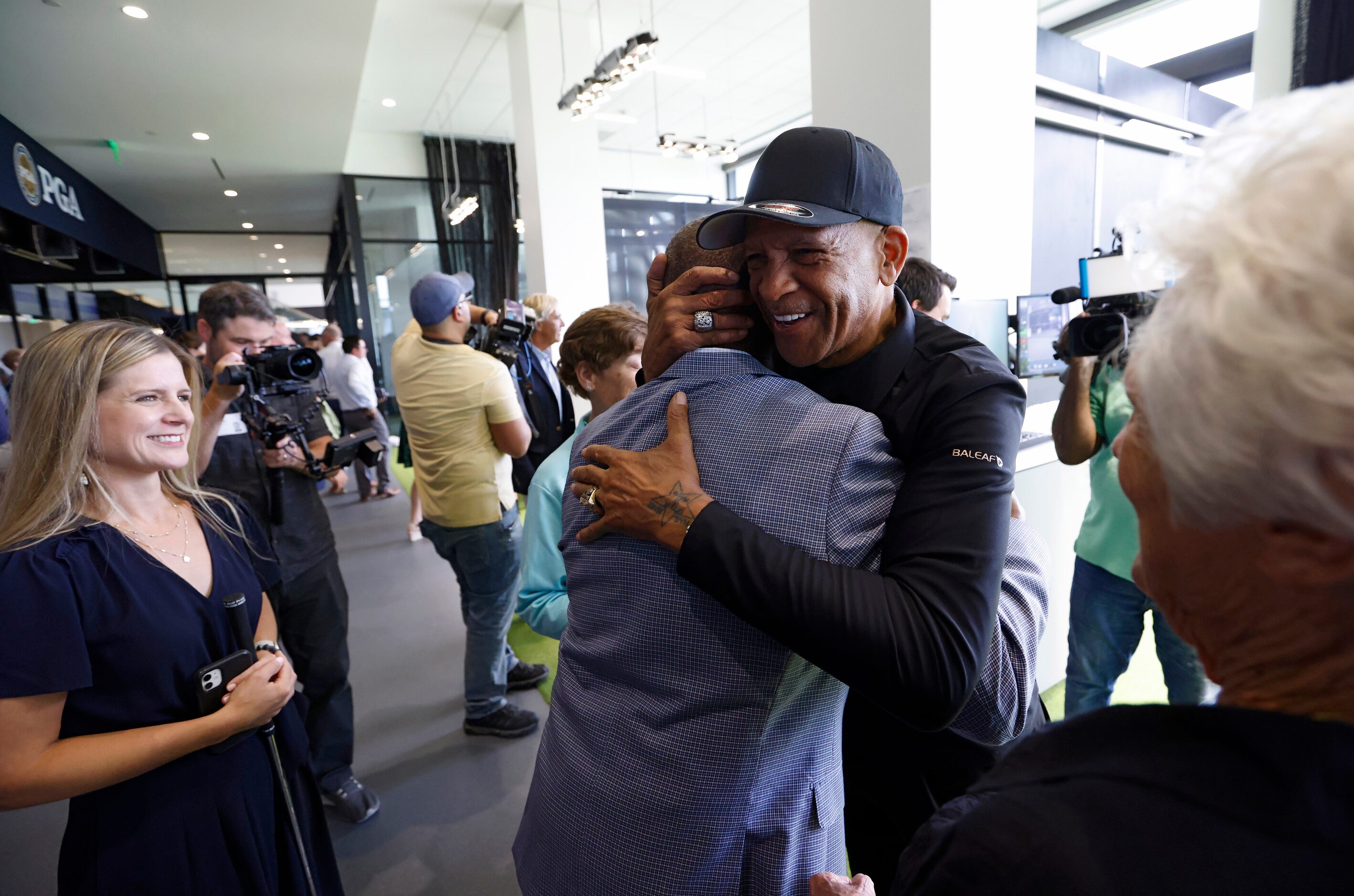 Pro Football Hall of Famers and former Dallas Cowboys players Tony Dorsett (center) and Drew...