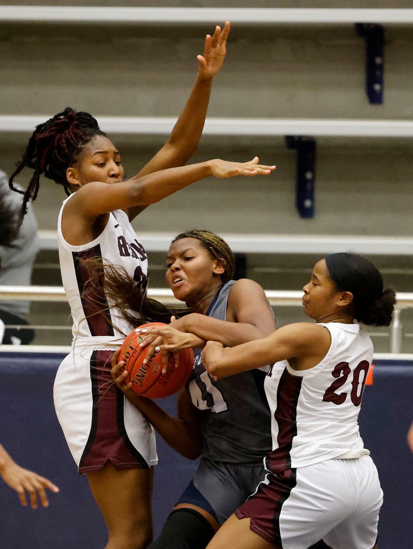 Wylie East’s Akasha Davis is fouled by Red Oak’s Makinzie Taplin (20 as Aniyah Johnson,...