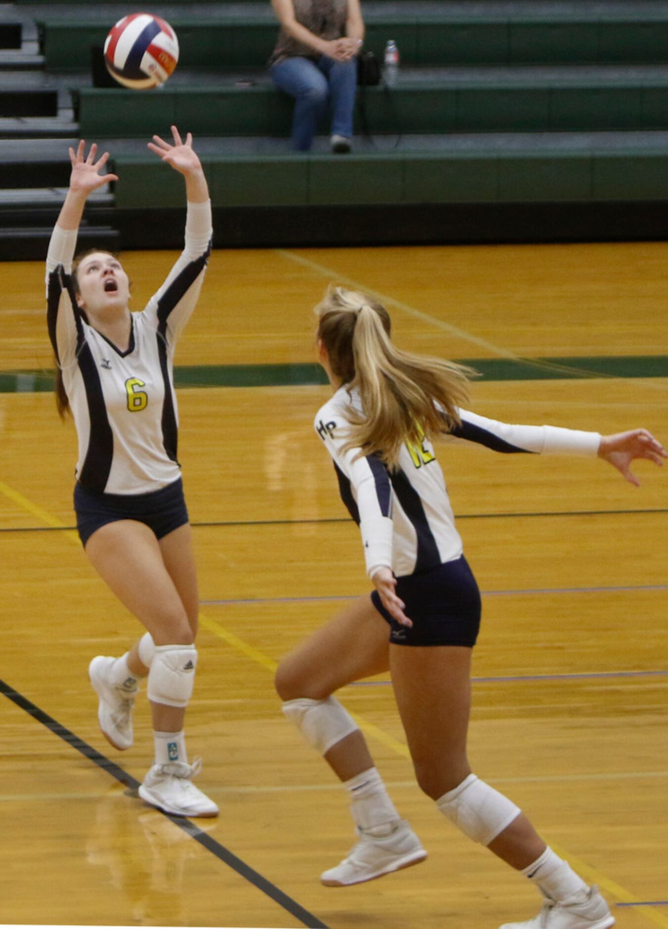 Highland Park setter Carter Ching (6) sets middle hitter Lauren McMahon (12) during the 2nd...