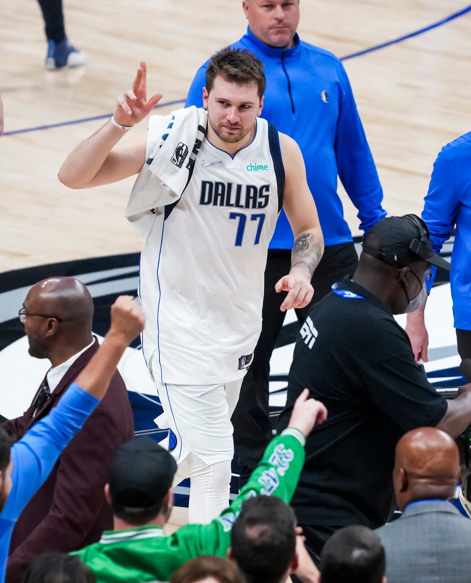 Dallas Mavericks guard Luka Doncic acknowledges the crowd as he leaves the court  after a...