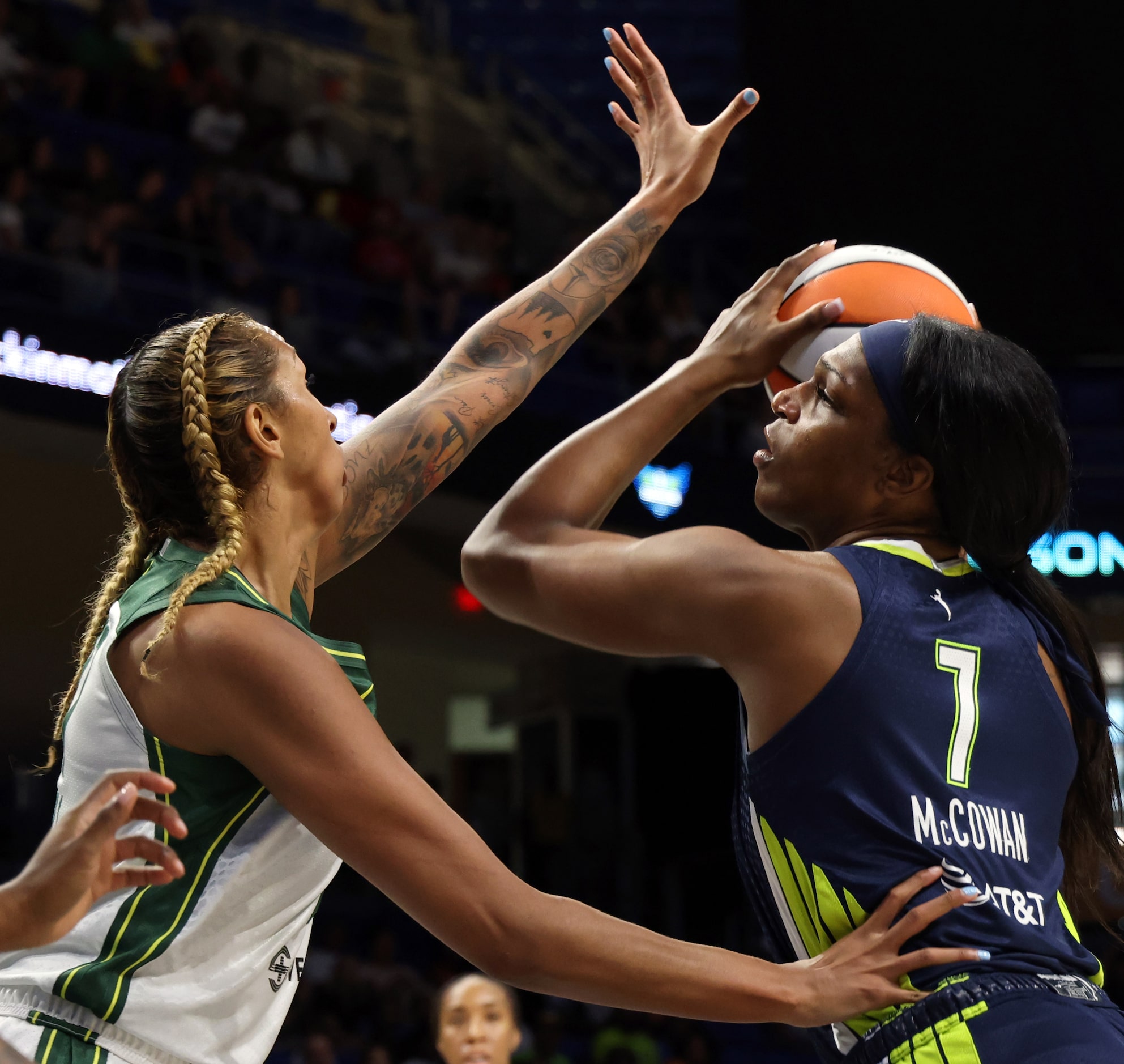 Dallas Wings center Teaira McCowan (7) looks to shoot against the defense of Seattle Storm...