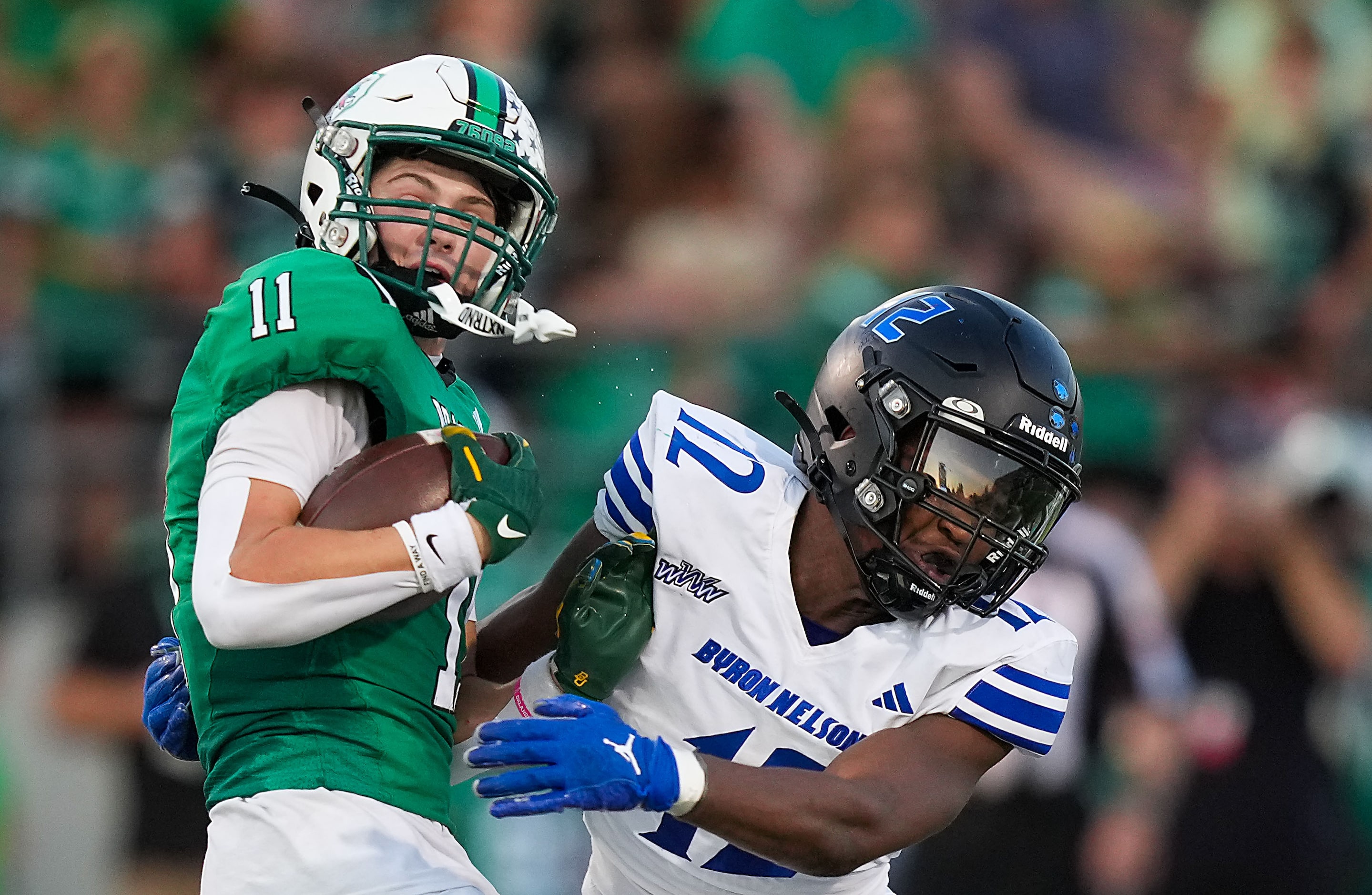 Southlake Carroll wide receiver Brock Boyd (11) spins away from Trophy Club Byron Nelson...