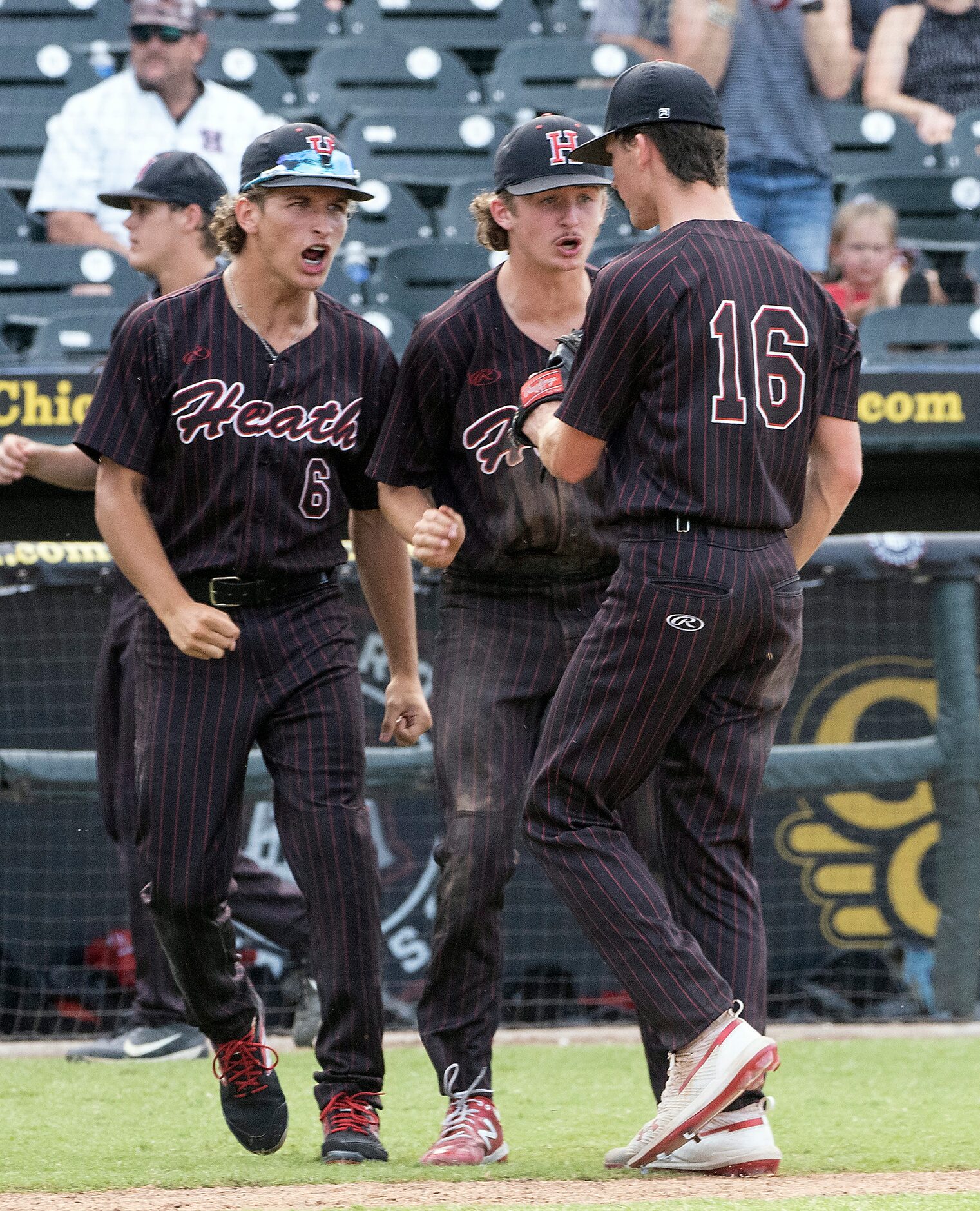 Rockwall-Heath Caden Fiveash, (16), is met by teammates Andrew Daniels, (6), and Baylor...