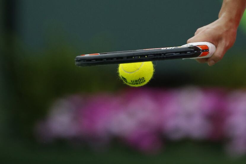 Mar 29, 2016; Key Biscayne, FL, USA; Simona Halep bounces a ball with her racquet against...