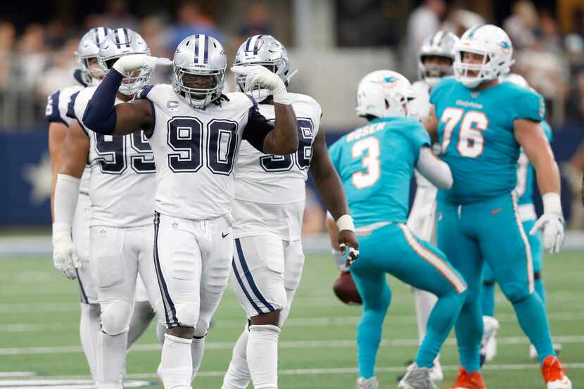 FILE - Cowboys defensive end DeMarcus Lawrence (90) celebrates a sack during the second half...