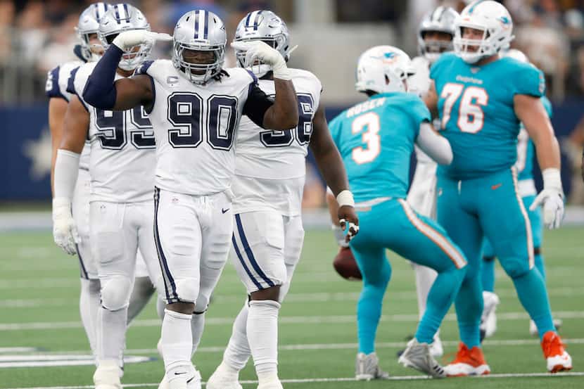 Dallas Cowboys defensive end Demarcus Lawrence (90) celebrates after sacking Miami Dolphins...