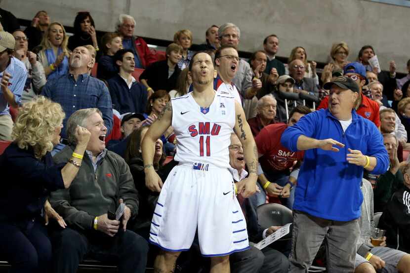 SMU Mustangs guard Nic Moore (11) reacts to missing a three pointer while being fouled by...