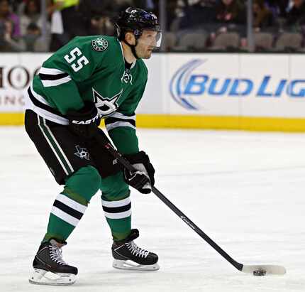 Dallas Stars defenseman Sergei Gonchar looks to pass during the first period against the...
