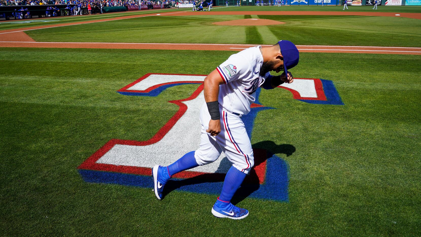 Texas Rangers second baseman Rougned Odor warms up before of a spring training game against...