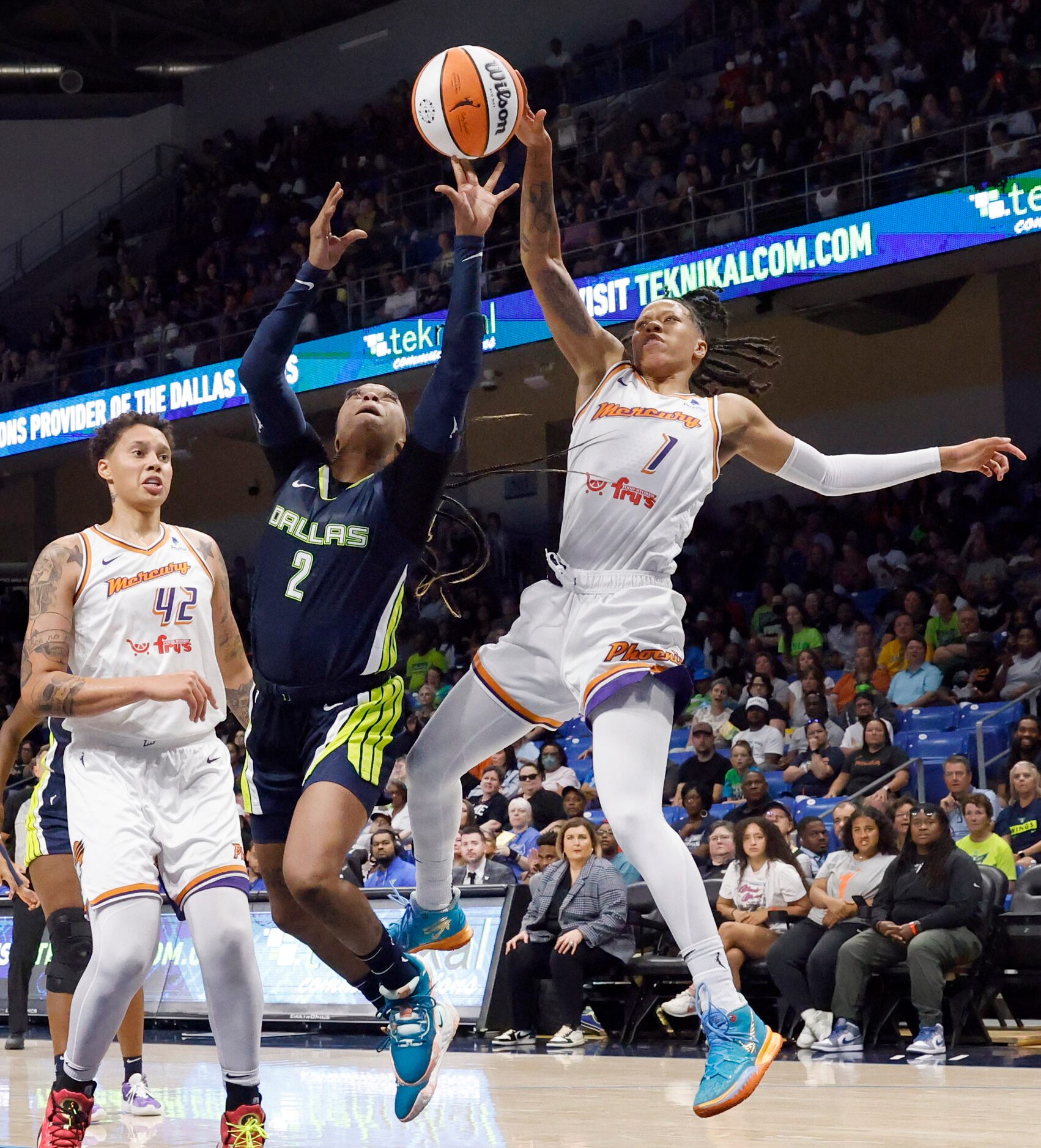 Dallas Wings guard Odyssey Sims (2) has shot blocked from behind by Phoenix Mercury guard...