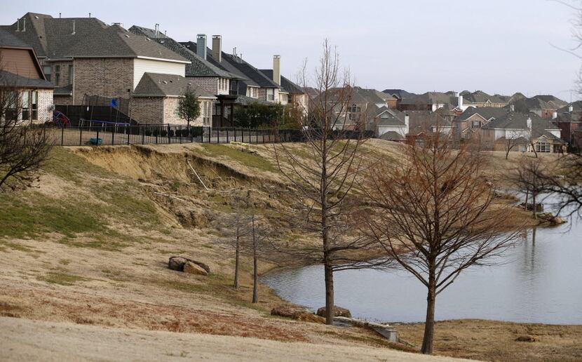 A neighborhood in Frisco shows the steady impact of erosion behind one house. A Little Elm...