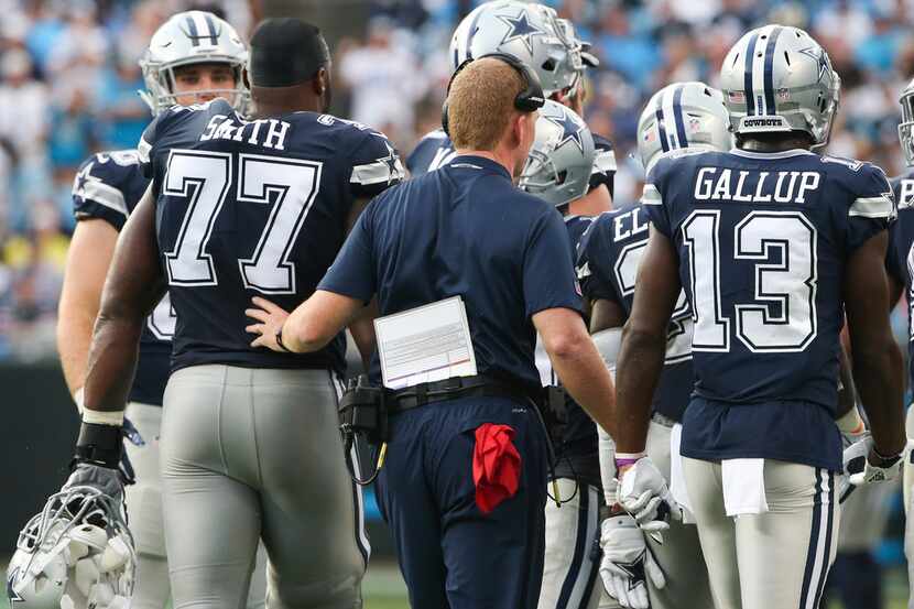 Dallas Cowboys head coach Jason Garrett celebrates with Dallas Cowboys offensive tackle...
