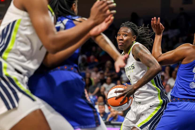 Dallas Wings forward Natasha Howard (6) looks for an opening in the Connecticut Sun defense...