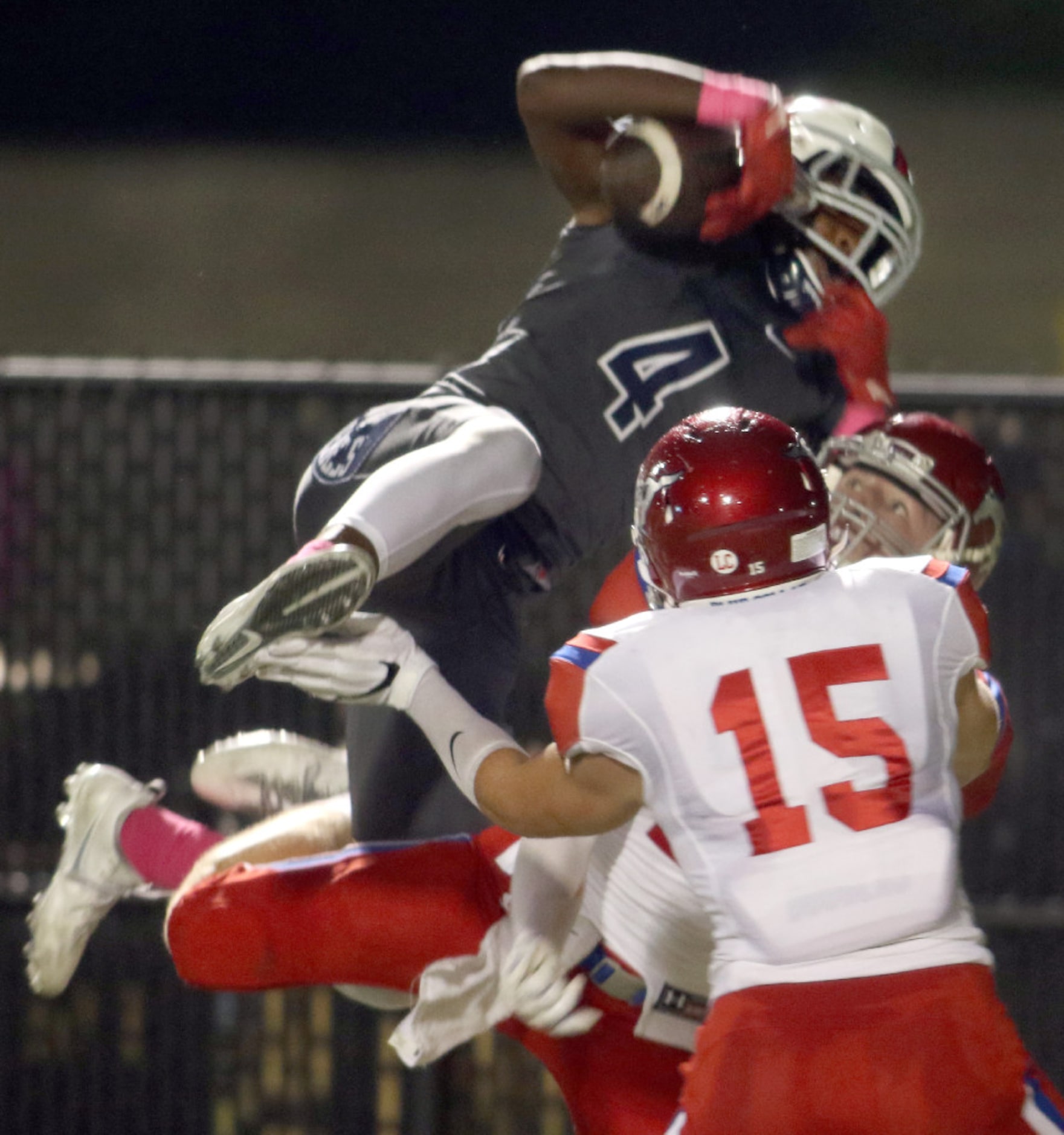 Richland receiver Rashee Rice (4) soars over the defense of Grapevine defensive back Zack...