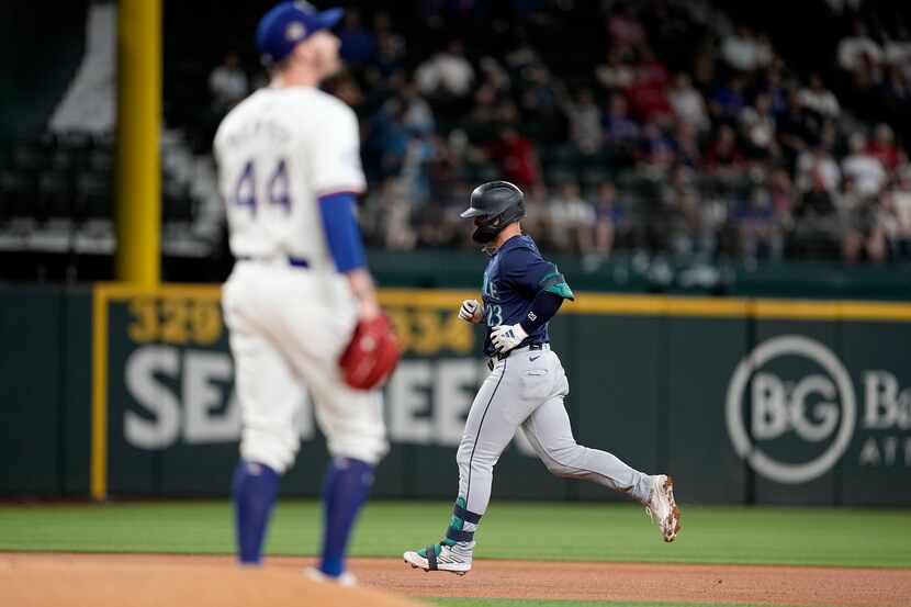 Seattle Mariners' Ty France rounds the bases after hitting a two-run home run off a pitch...