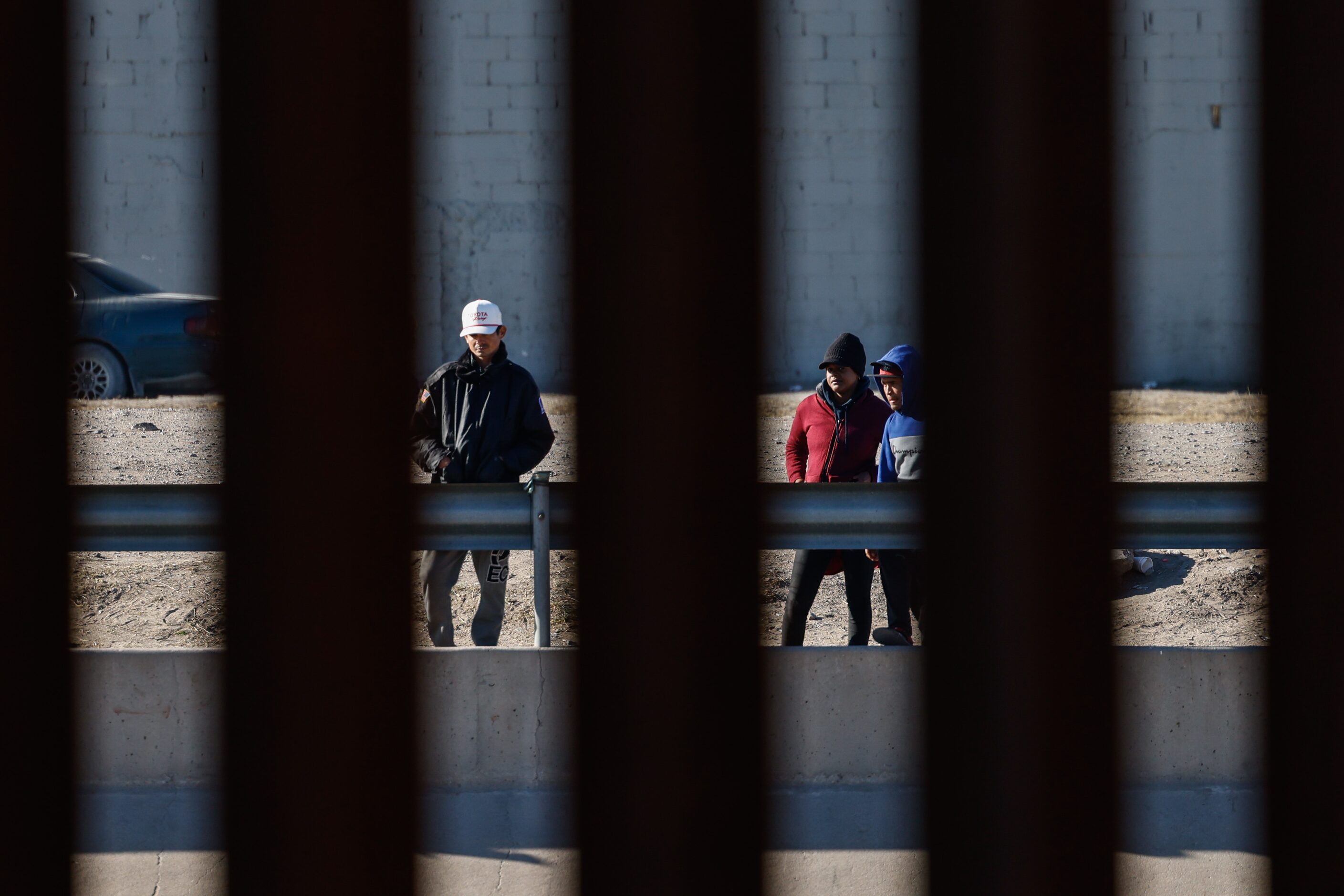 People on the Mexican side of the border, watch the Texas National Guard guards the...