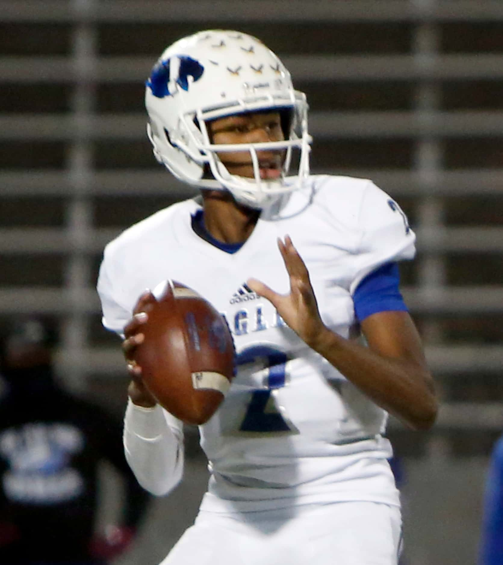 Wilmer Hutchins quarterback Andre Henderson (2) looks to pass downfield during first quarter...