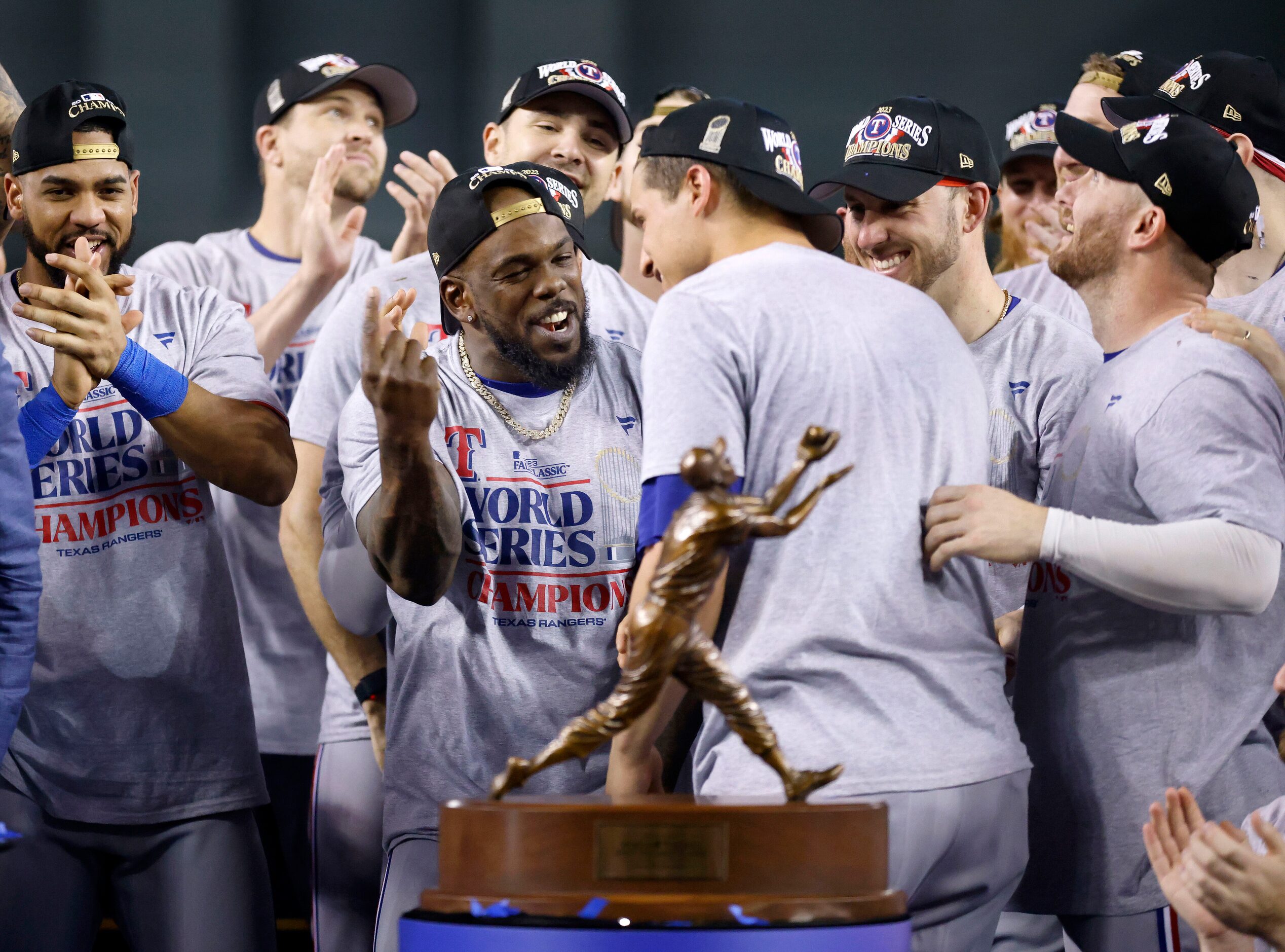 Adolis Garcia (left) congratulates Texas Rangers shortstop Corey Seager on his Most Valuable...