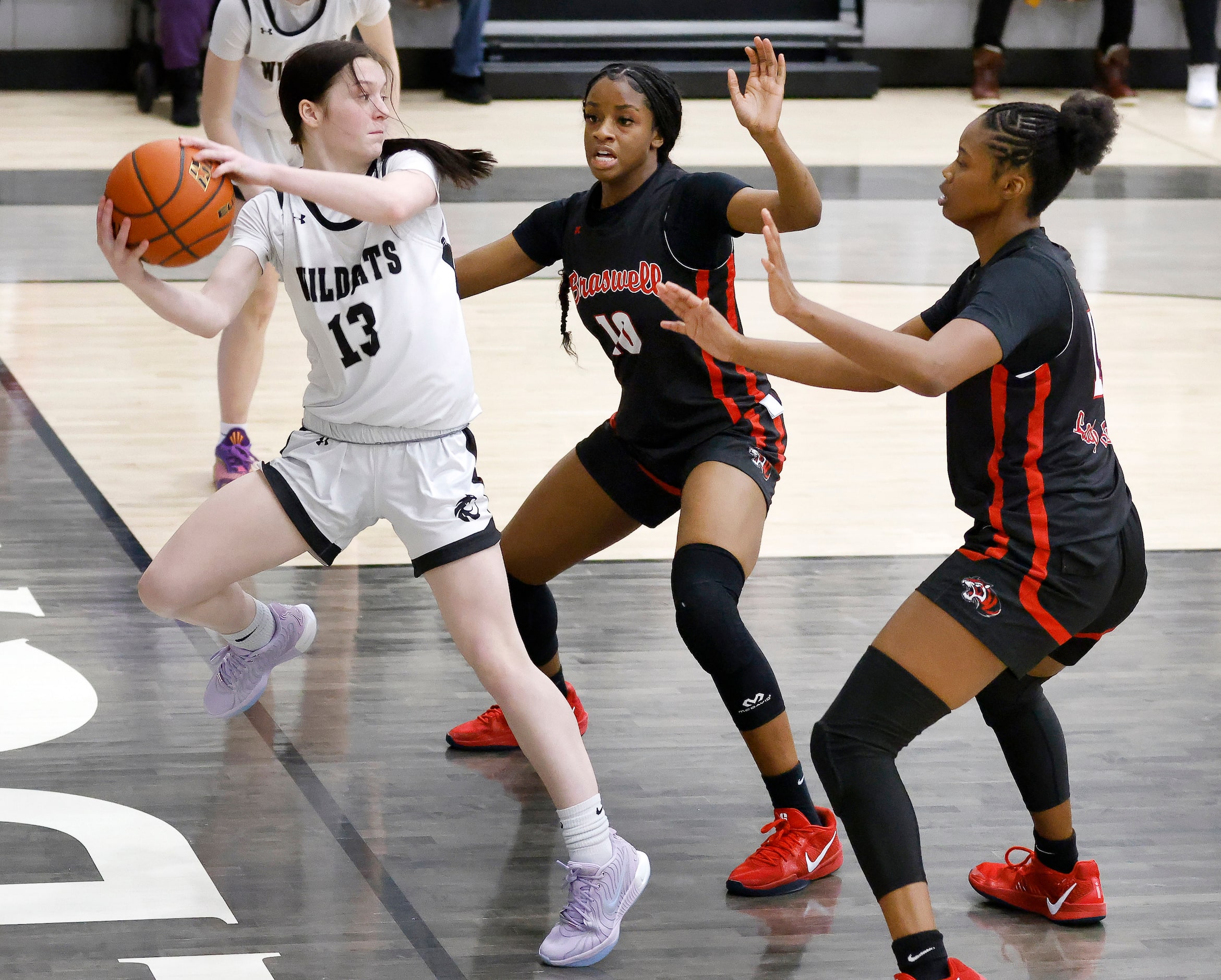 Denton Guyer guard Kate Sikes (13) saves the ball from going out of bounds against Denton...