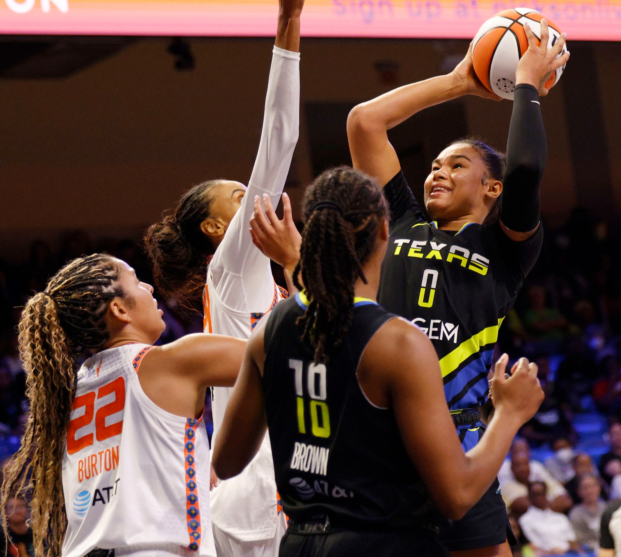 Dallas Wings forward Satou Sabally (0) shoots over Connecticut Sun guard Veronica Burton...