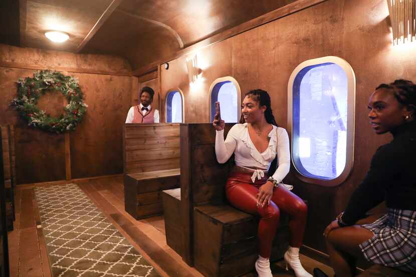 Conductor Craig Whitfield (left) starts the immersive train experience for Beverly Coleman...