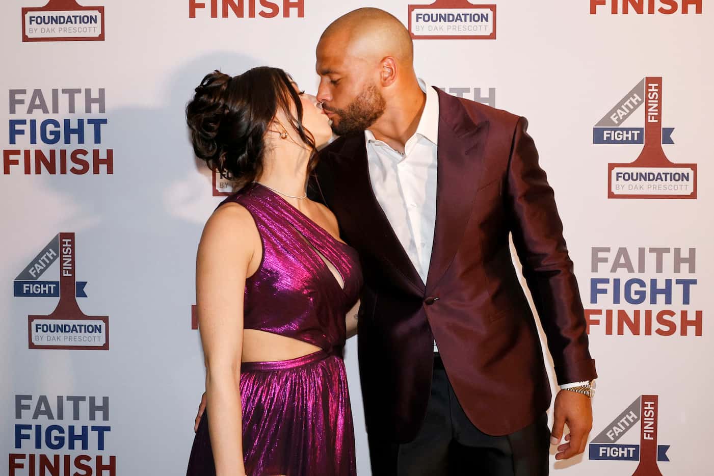Dallas Cowboys quarterback Dak Prescott kisses his girlfriend Sarah Jane Ramos during the...