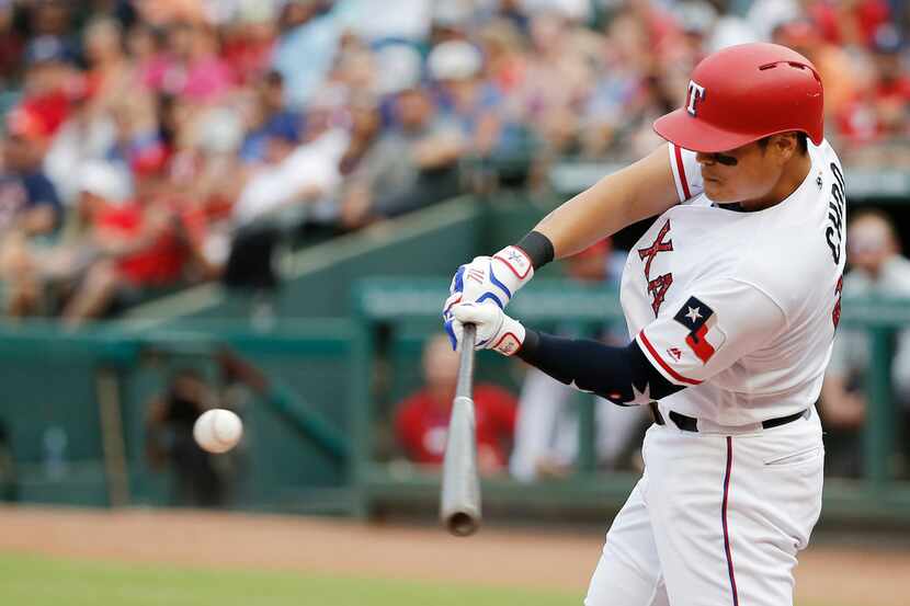 Texas Rangers' Shin-Soo Choo hits a solo home run during the third inning of the team's...