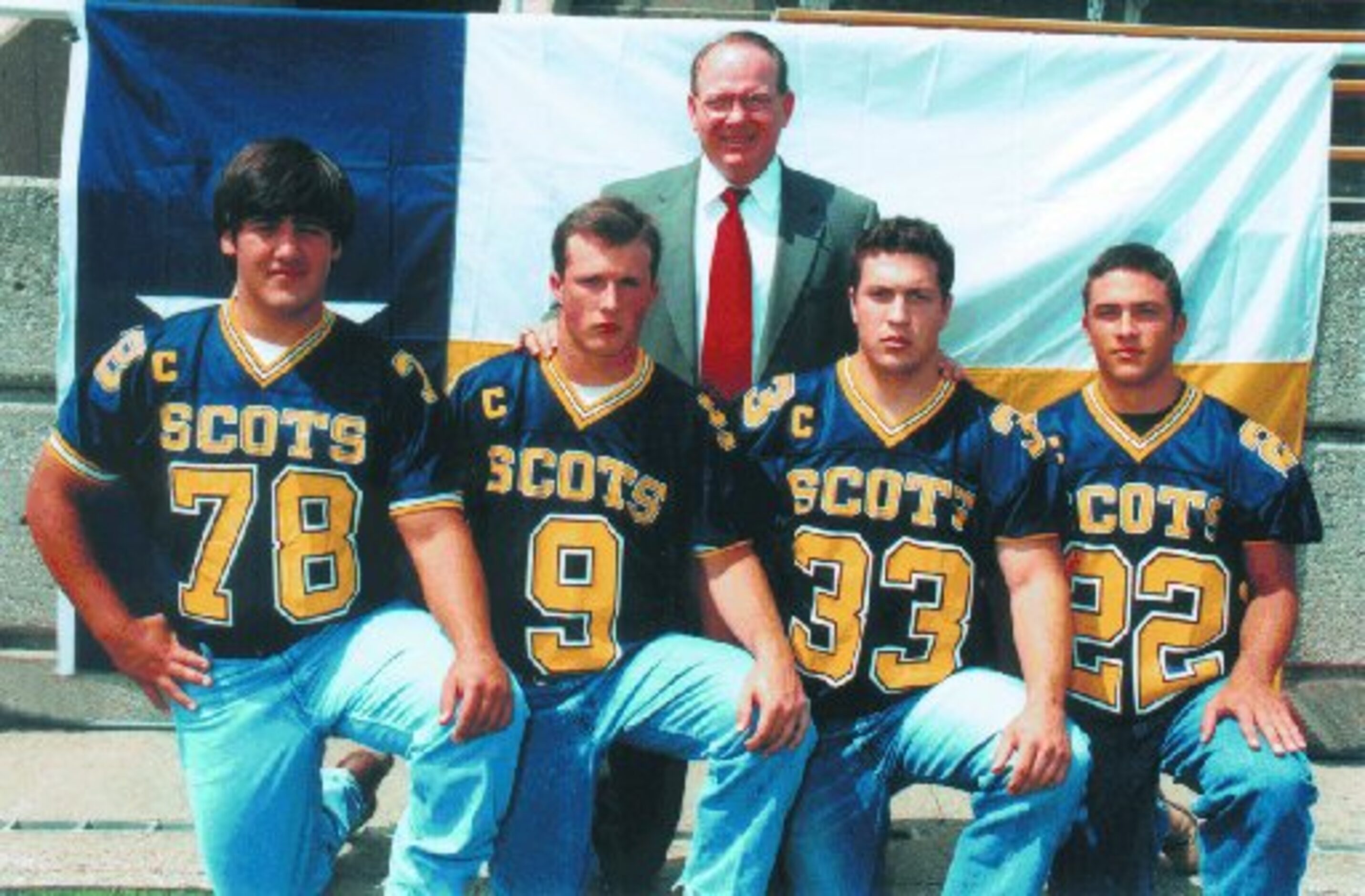 Highland Park High School Head Varsity Football Coach Randy Allen with
Captains Matthew...