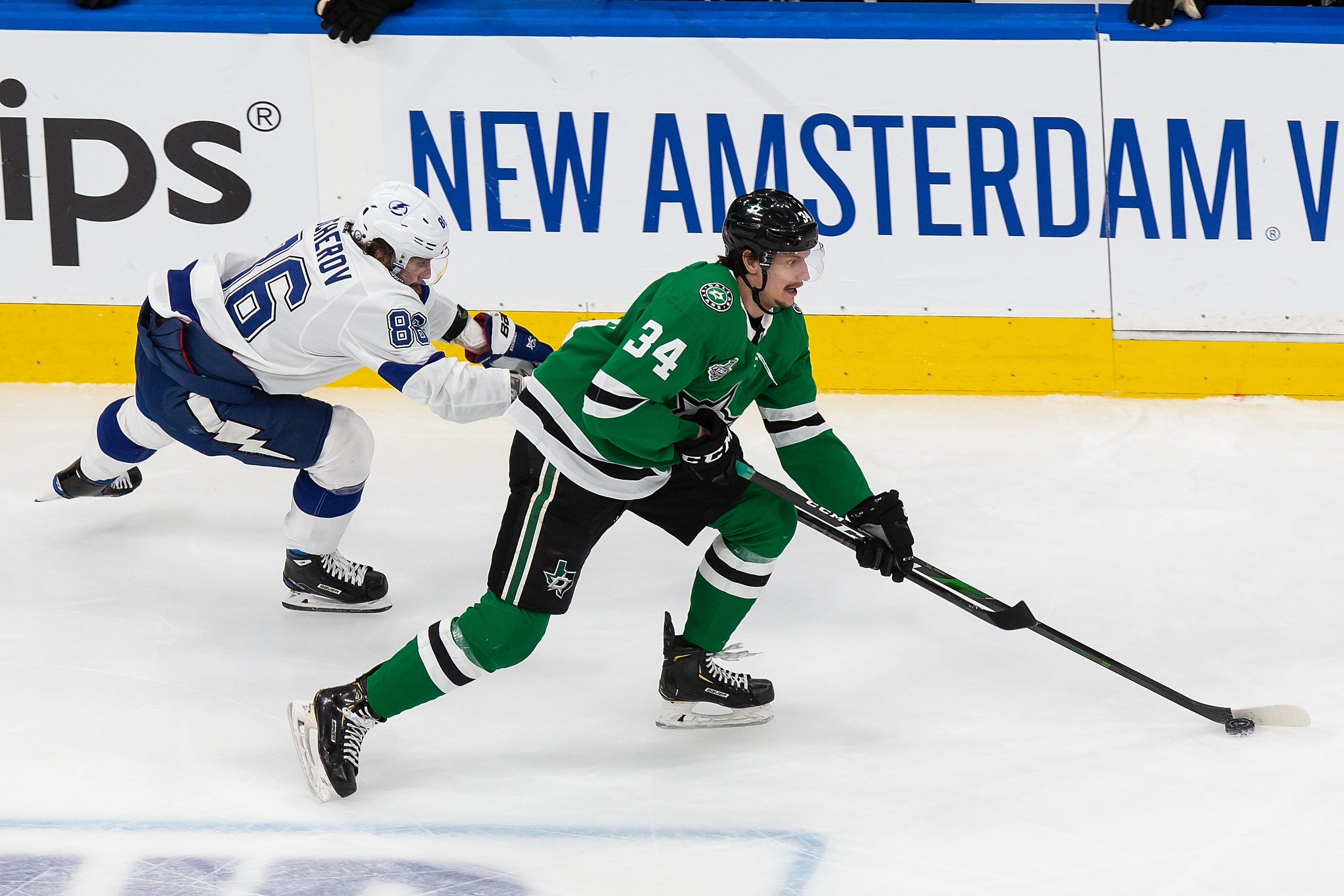 Denis Gurianov (34) of the Dallas Stars battles against Nikita Kucherov (86) of the Tampa...