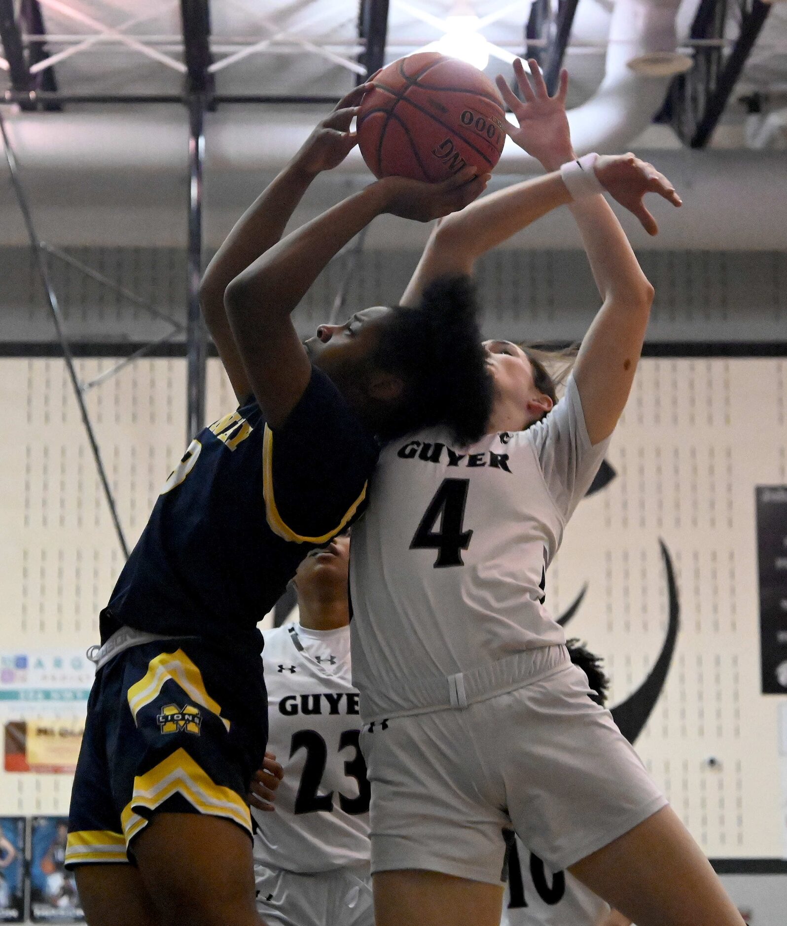 McKinney’s Jerzee Jordan shoots over Denton Guyer’s Evie Goetz (4) in the first half of a...