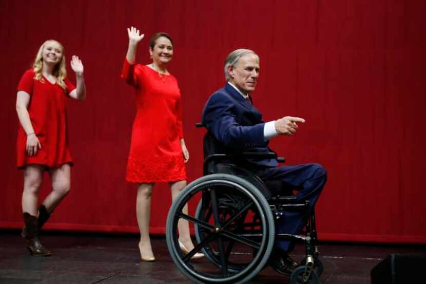 
Texas Governor-elect Greg Abbott, wife Cecilia and daughter Audrey took the stage during...