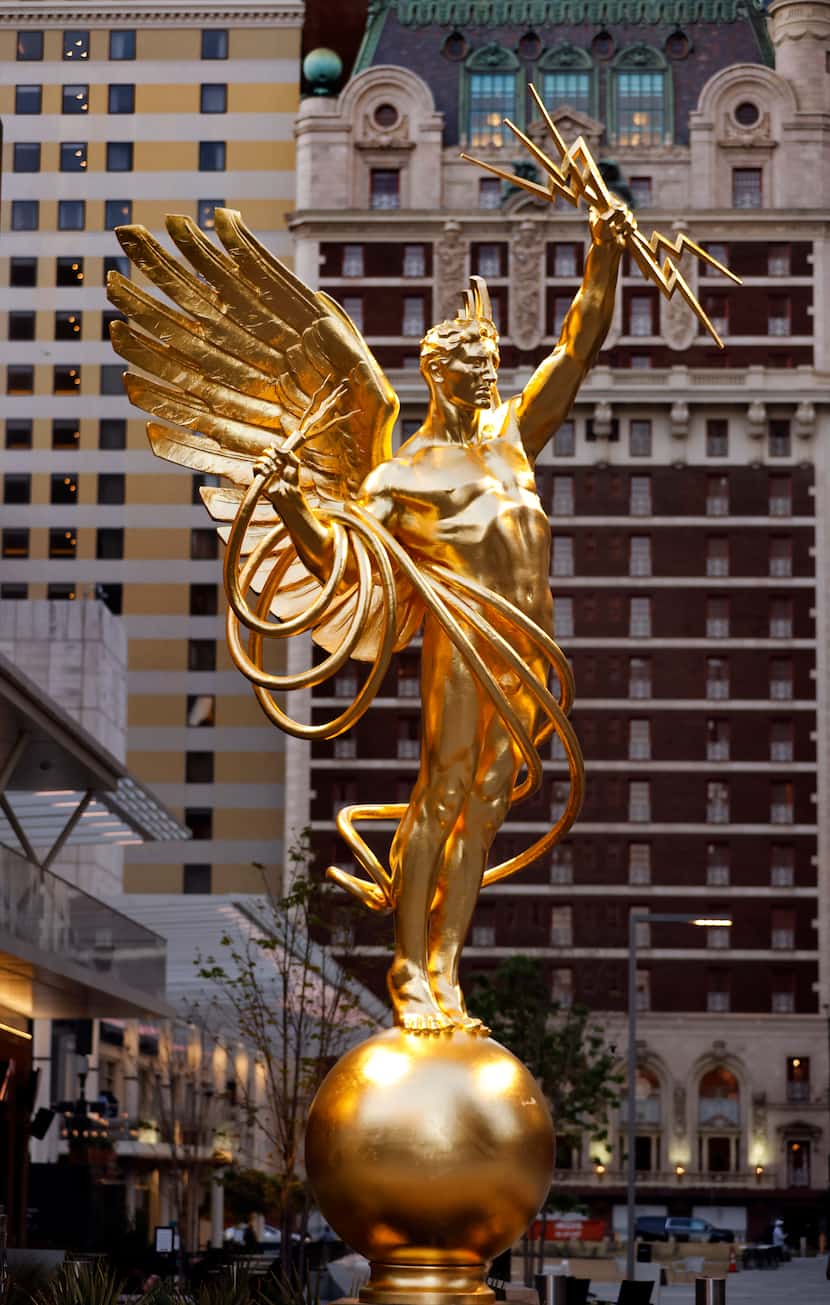 "Golden Boy," the Spirit of Communication statue, is pictured at South  Akard and Wood...