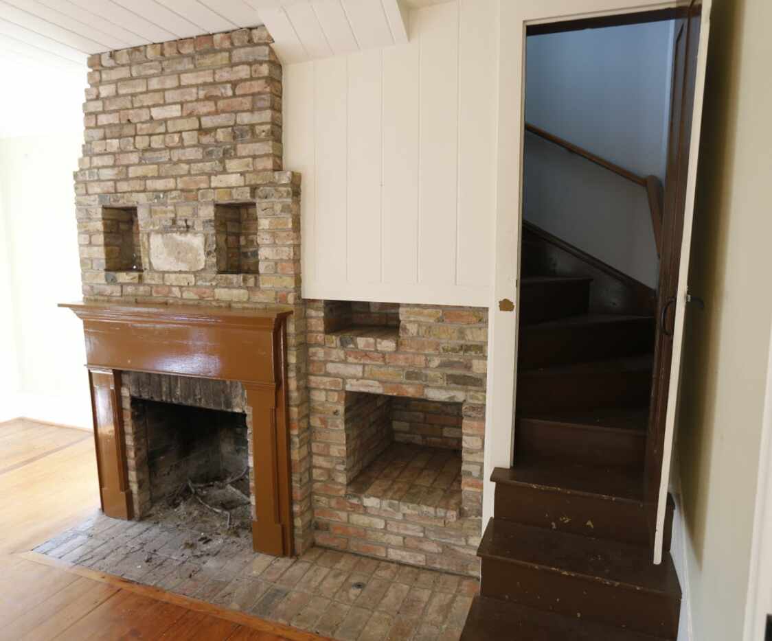The original stairs and a fireplace at Collinwood House in Plano on  Nov. 6, 2014. 