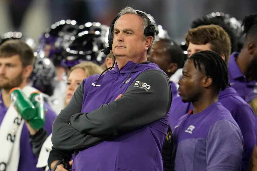 FILE - TCU head coach Sonny Dykes, center, watches play against Georgia during the first...
