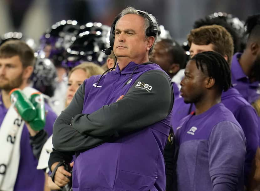 FILE - TCU head coach Sonny Dykes, center, watches play against Georgia during the first...