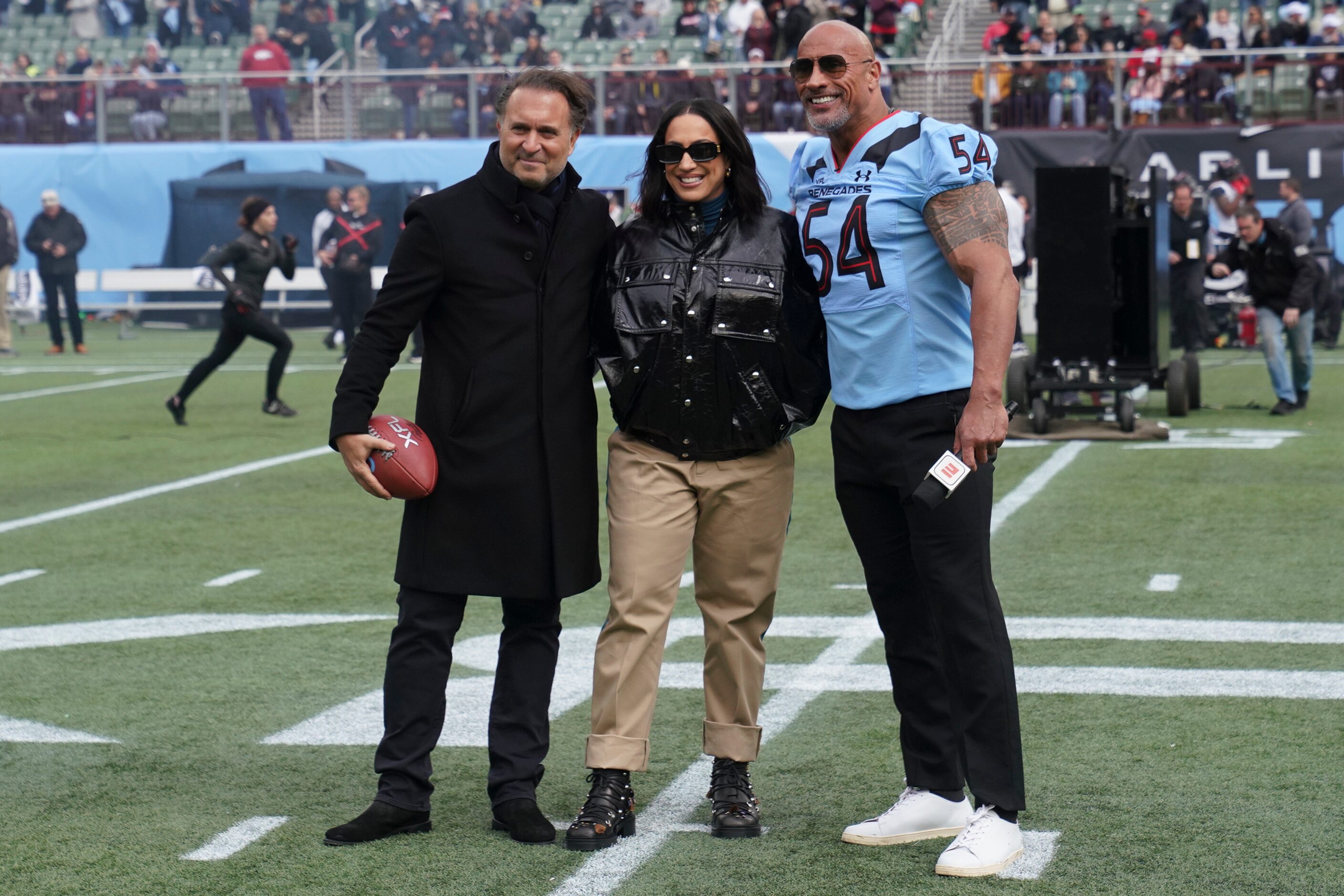 Gerry Cardinale, Dany Garcia and Dwayne “The Rock” Johnson take a photo together before an...