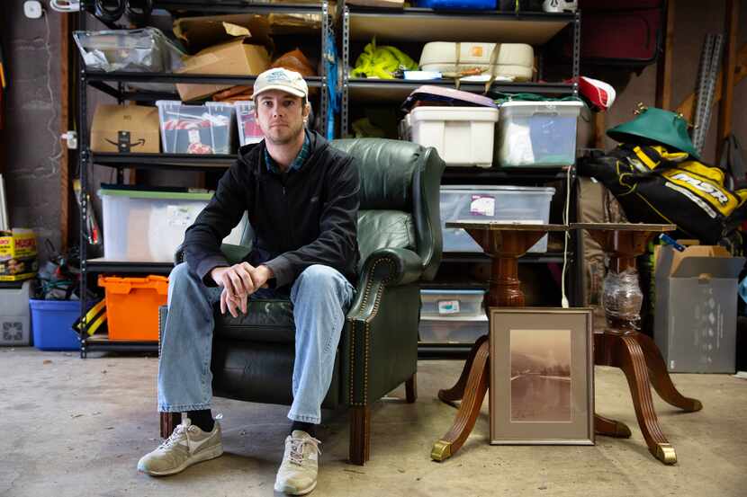 Travis Willoughby poses in his garage at his home in Dallas on Sunday. More millennials are...