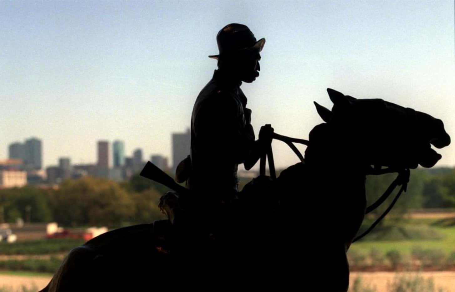 'Trooper of the Plains,' a bronze by Frederic Remington set against the Fort Worth skyline...