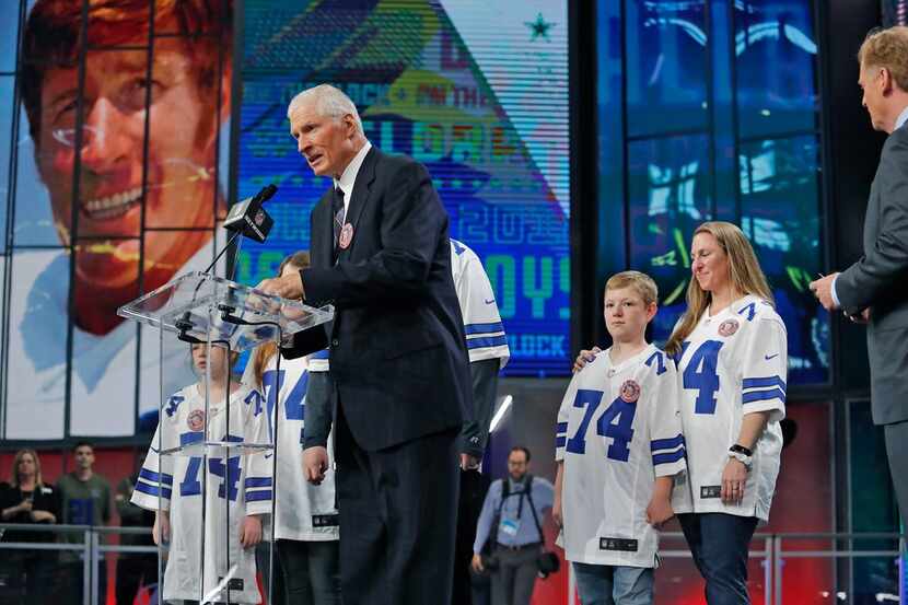 Dallas Cowboy great Bob Lilly, with the family of Army Capt. Ellery Ray Wallace, who was...