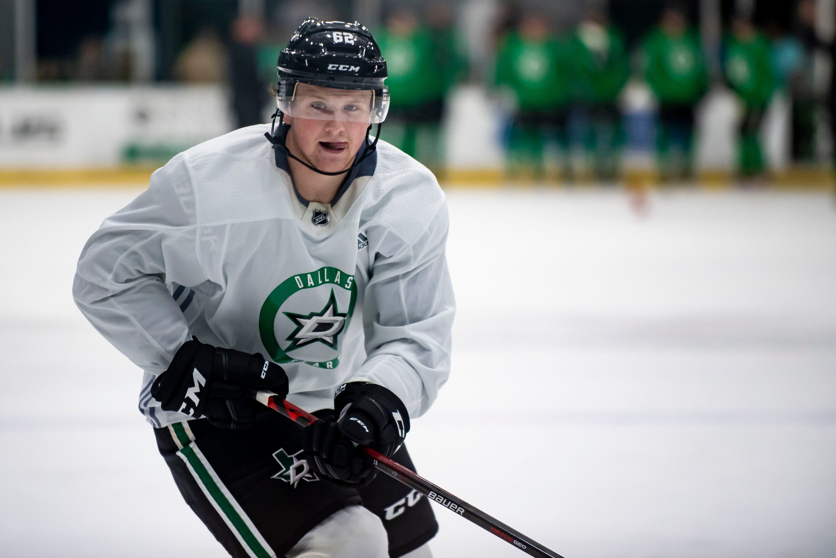 Forward Justin Ertel (62) skates through a drill after firing a shot at the goal during the...