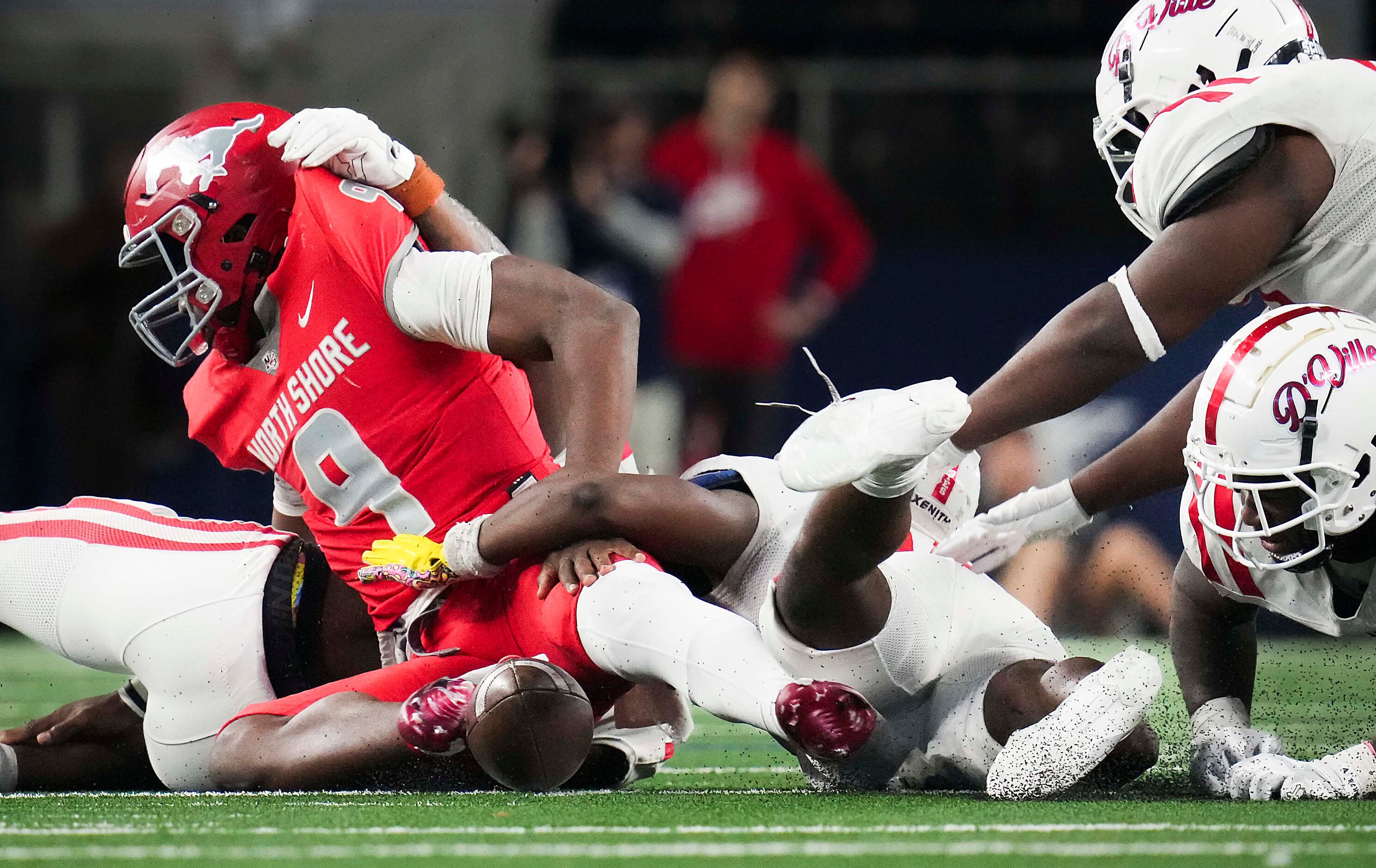 Galena Park North Shore quarterback  Kaleb Bailey (9) turns the ball over with a fumble as...