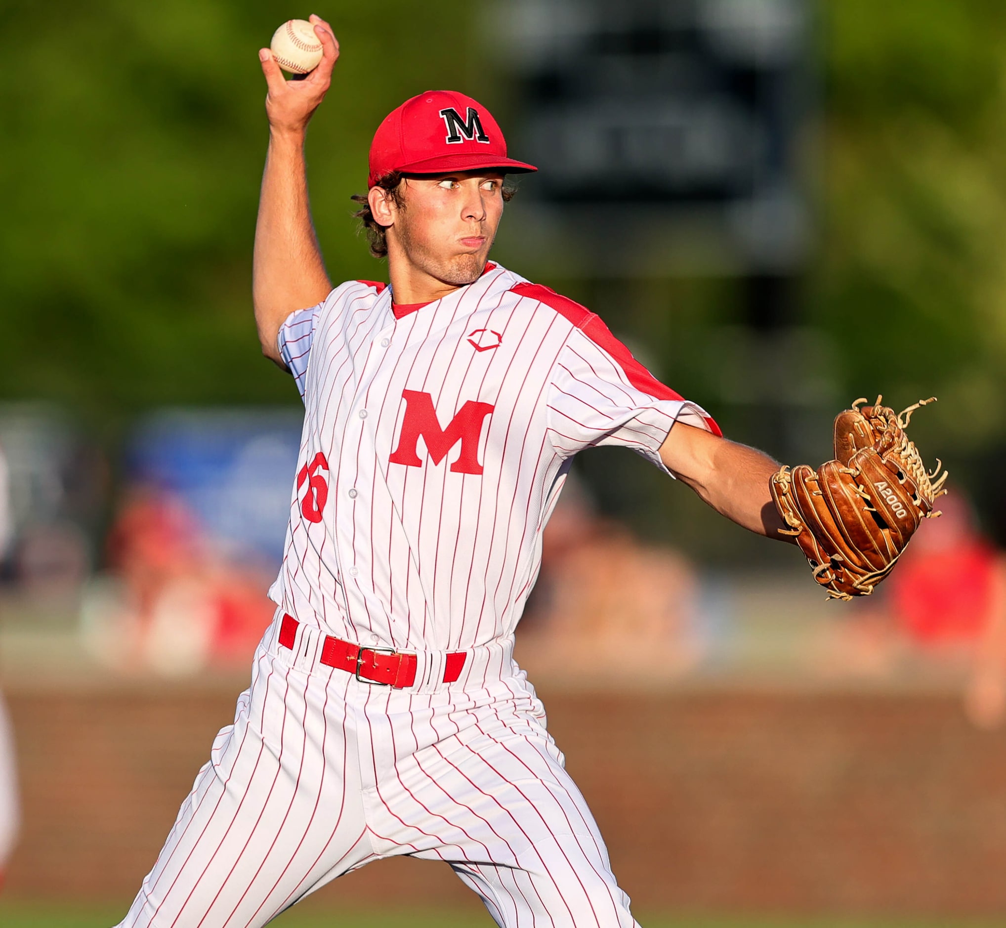 Flower Mound Marcus starting pitcher Tate Evans delivers a pitch to Keller during game 1 of...