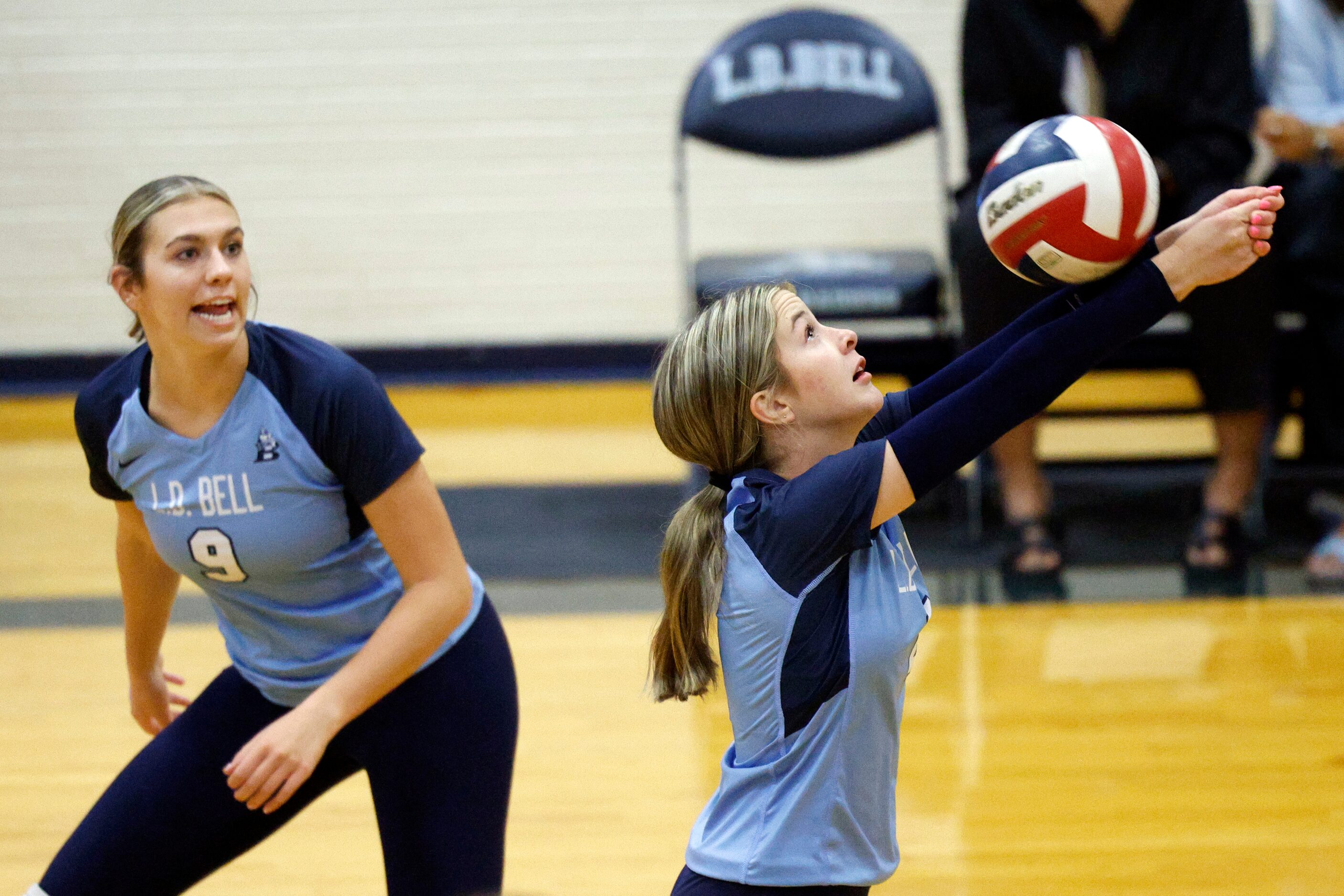 L.D. Bell's Presle Tarver (2) passes the ball over her head alongside Riley Northrup (9)...