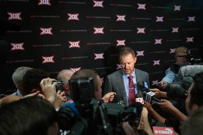 University of Oklahoma head football coach Lincoln Riley speaks with reporters during the...