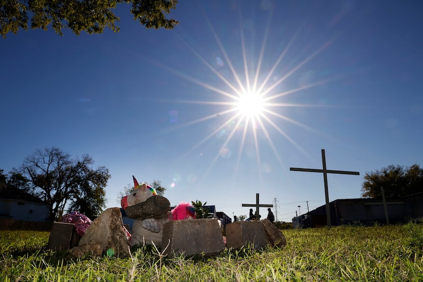 A memorial for Mercedes Taylor is seen behind Dallas International Street Church, Thursday,...